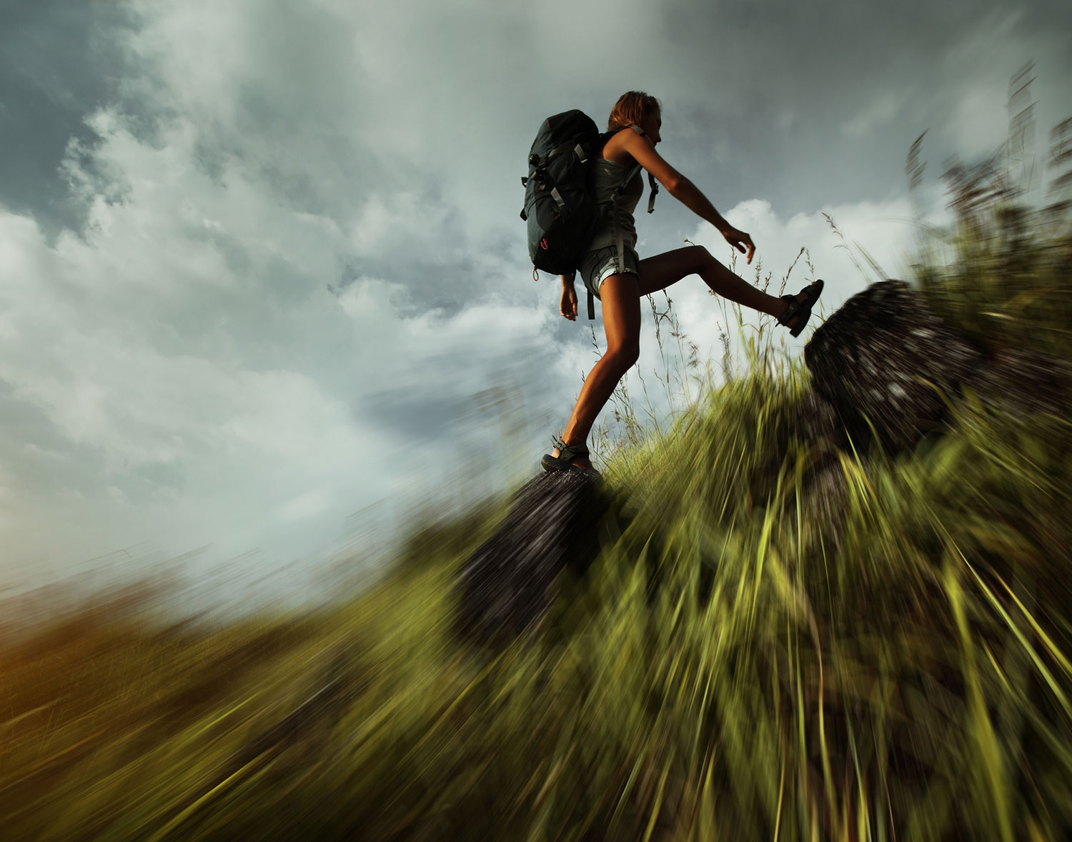 Woman hiking up a hill