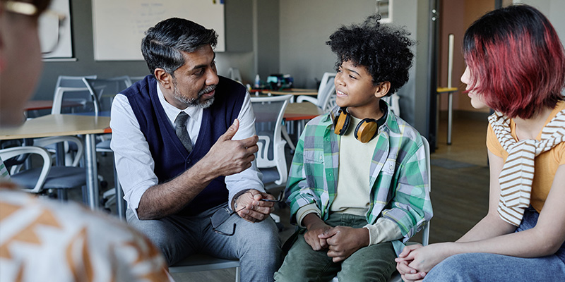 Students talking to a school counselor